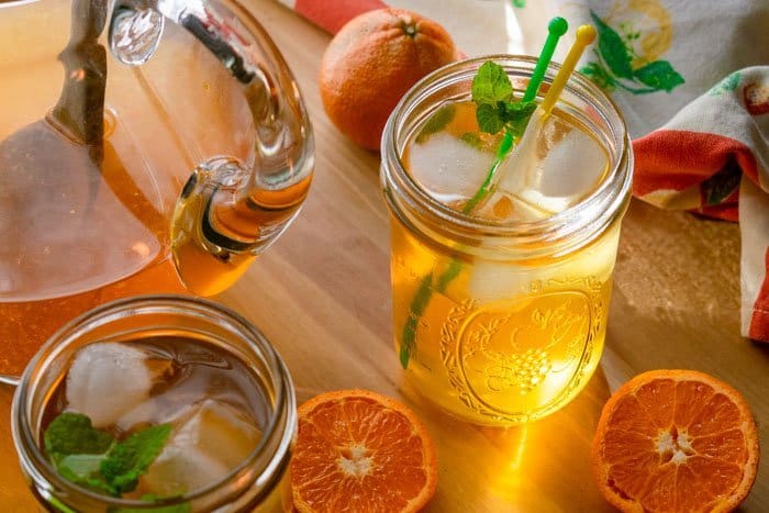 glass of sunshine tea sitting on table
