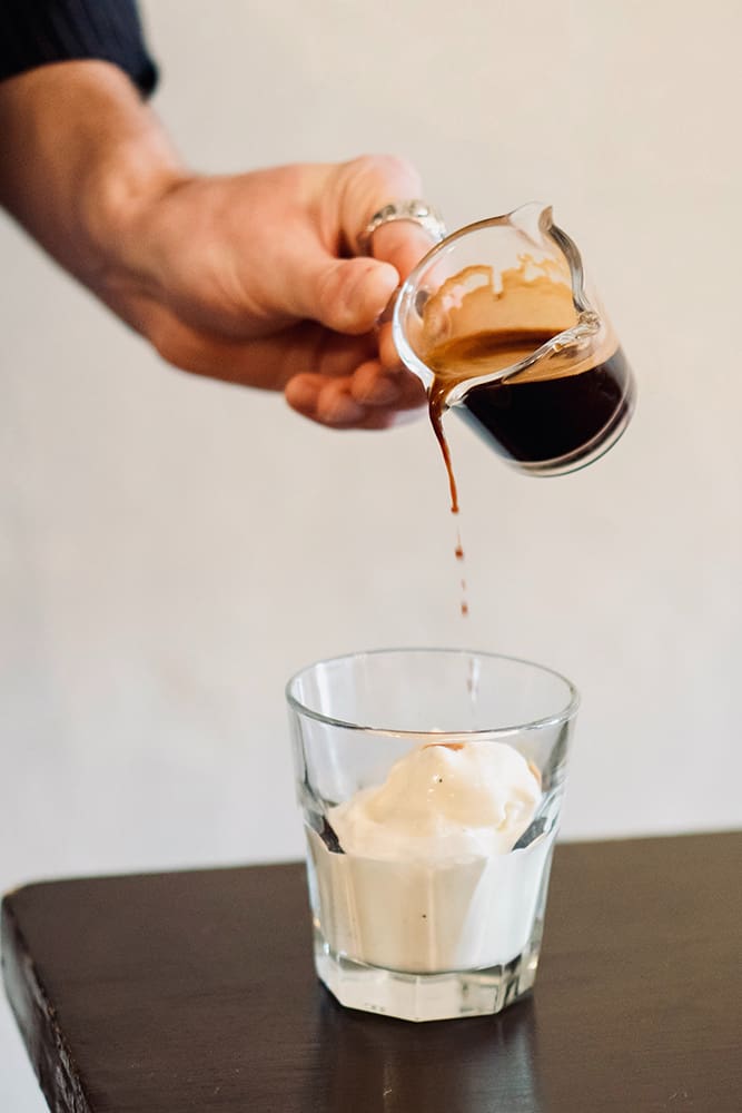 Pouring Espresso over Ice Cream for affogato