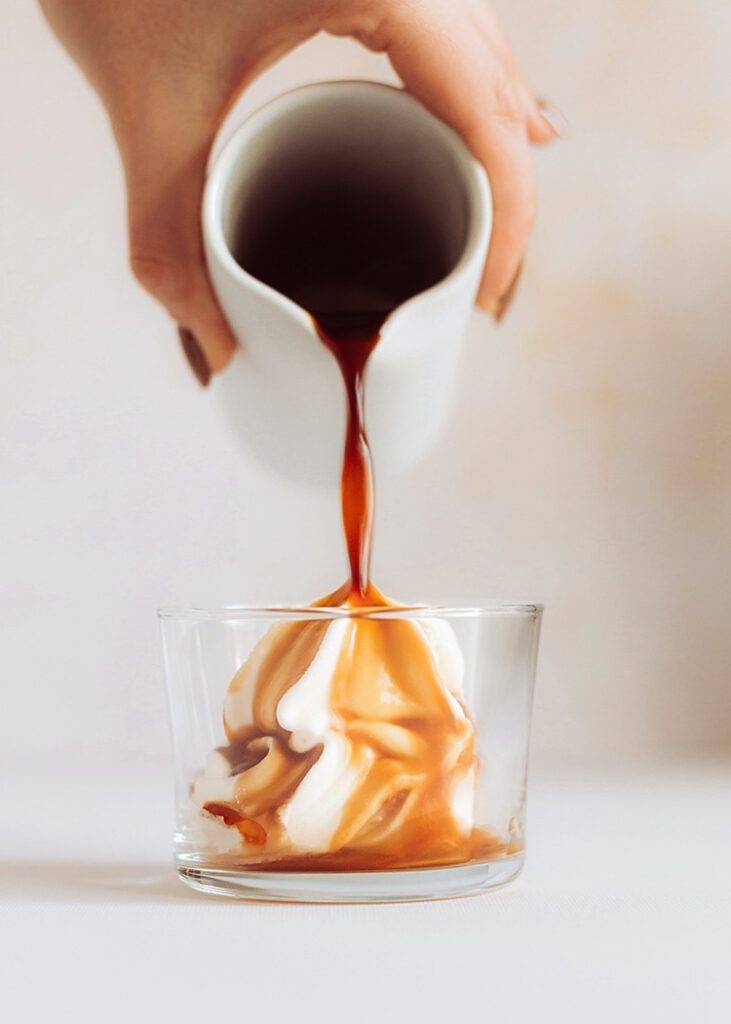 Pouring Espresso Over Vanilla Gelato For An Affogato