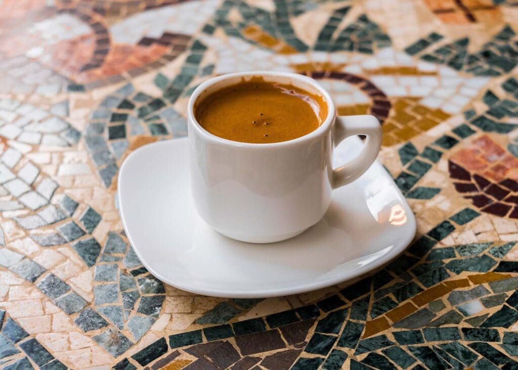 A double espresso in a demitasse cup