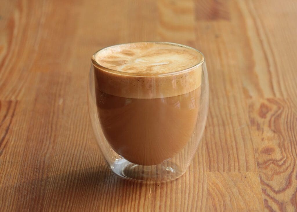 Macchiato in a glass cup