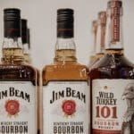3 bottles of bourbon including Jim Beam and Wild Turkey