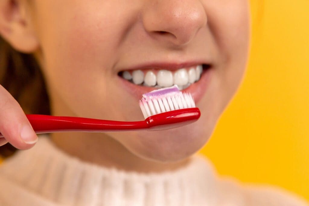 Brush them teeth! a young woman brushing her teeth