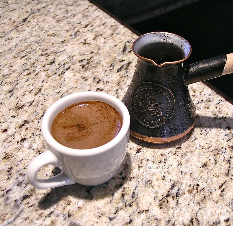Café Turco: Exploring Turkish Coffee Turkish coffee next to a special pot called a cezve or ibrik