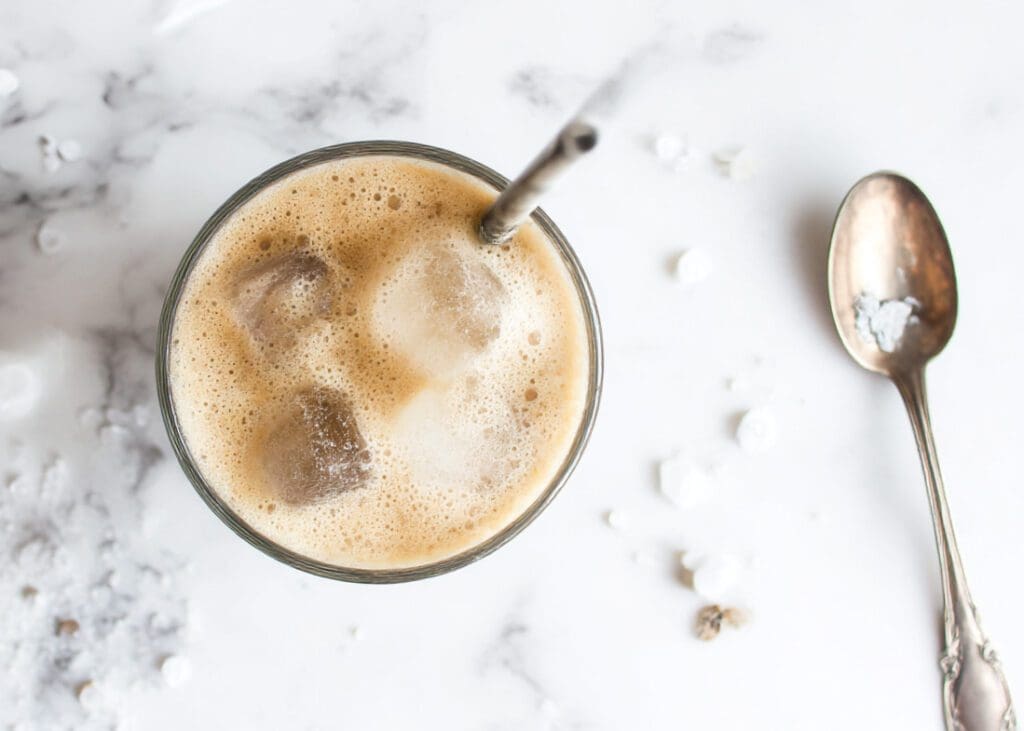 iced Greek frappe in glass with foam