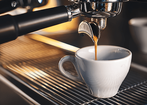 What Is an Americano? Recipe, History, and How It Differs From Drip Coffee Espresso pouring into white cup