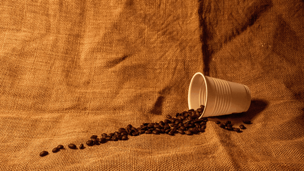 Spilled coffee beans from cup