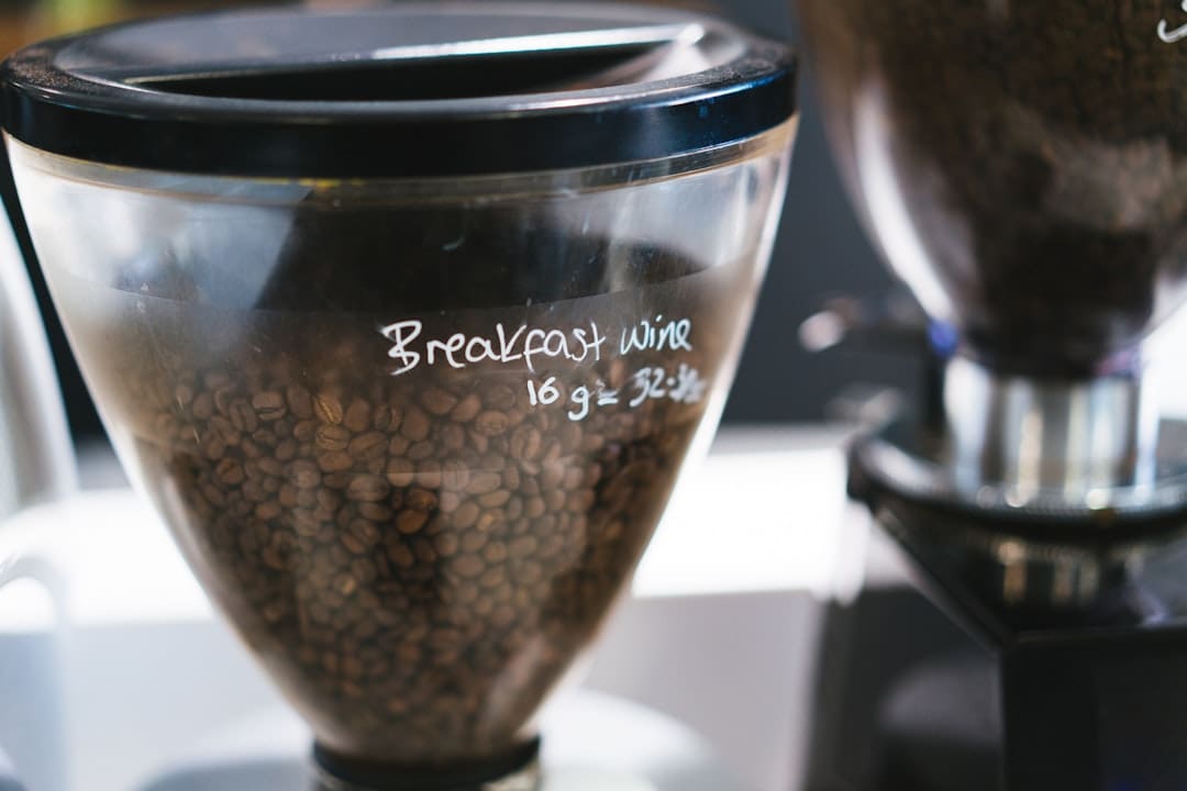 a blender filled with beans sitting on top of a counter