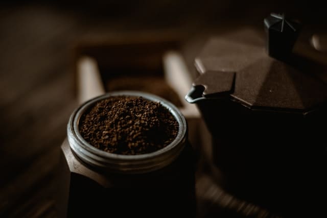 Ground coffee in a container