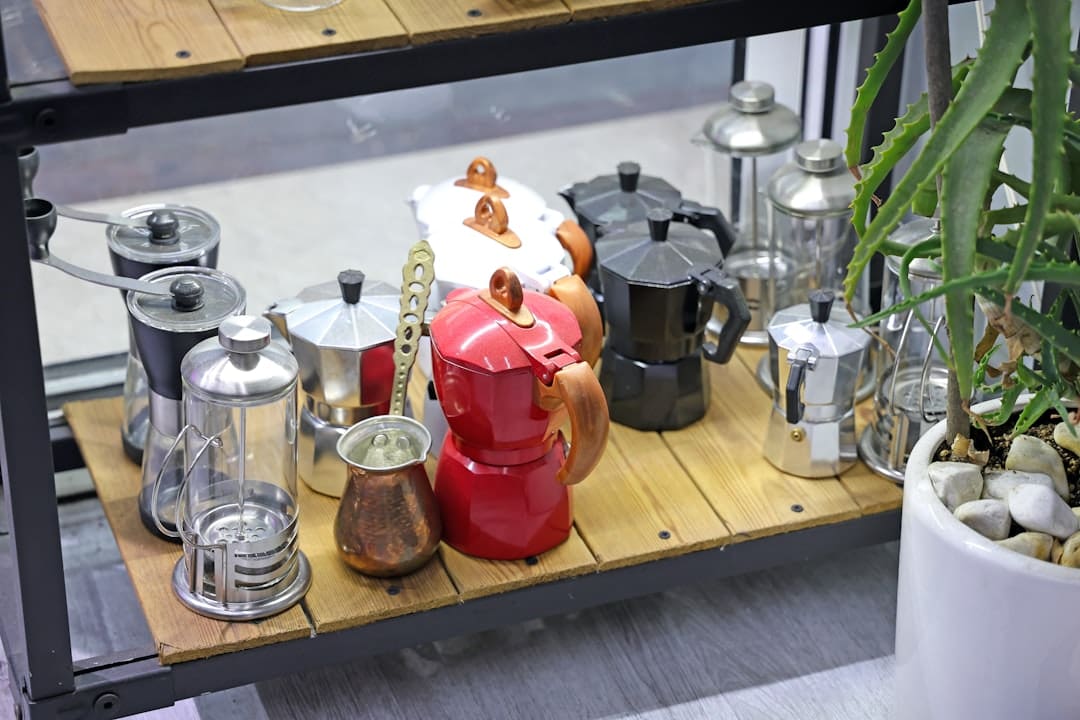 Collection of italian moka pots on a wooden shelf