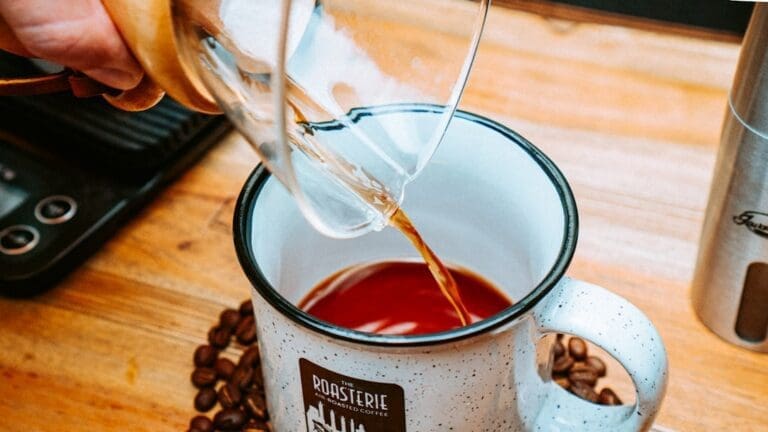 Best Coffee for Chemex: Why Light to Medium Roasts Work Best a person pours coffee into a mug